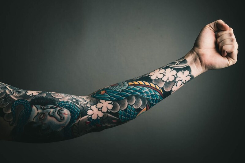 Colourful sleeve tattoo
